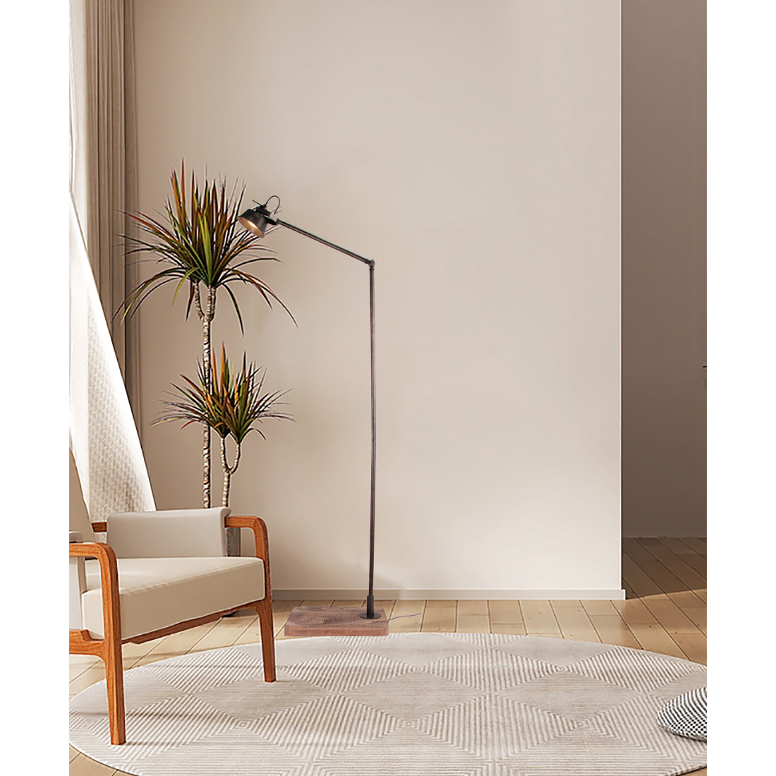 Various Max vloerlamp geplaatst in een woonkamer of studeerkamer, die gericht licht en sfeer verspreidt.