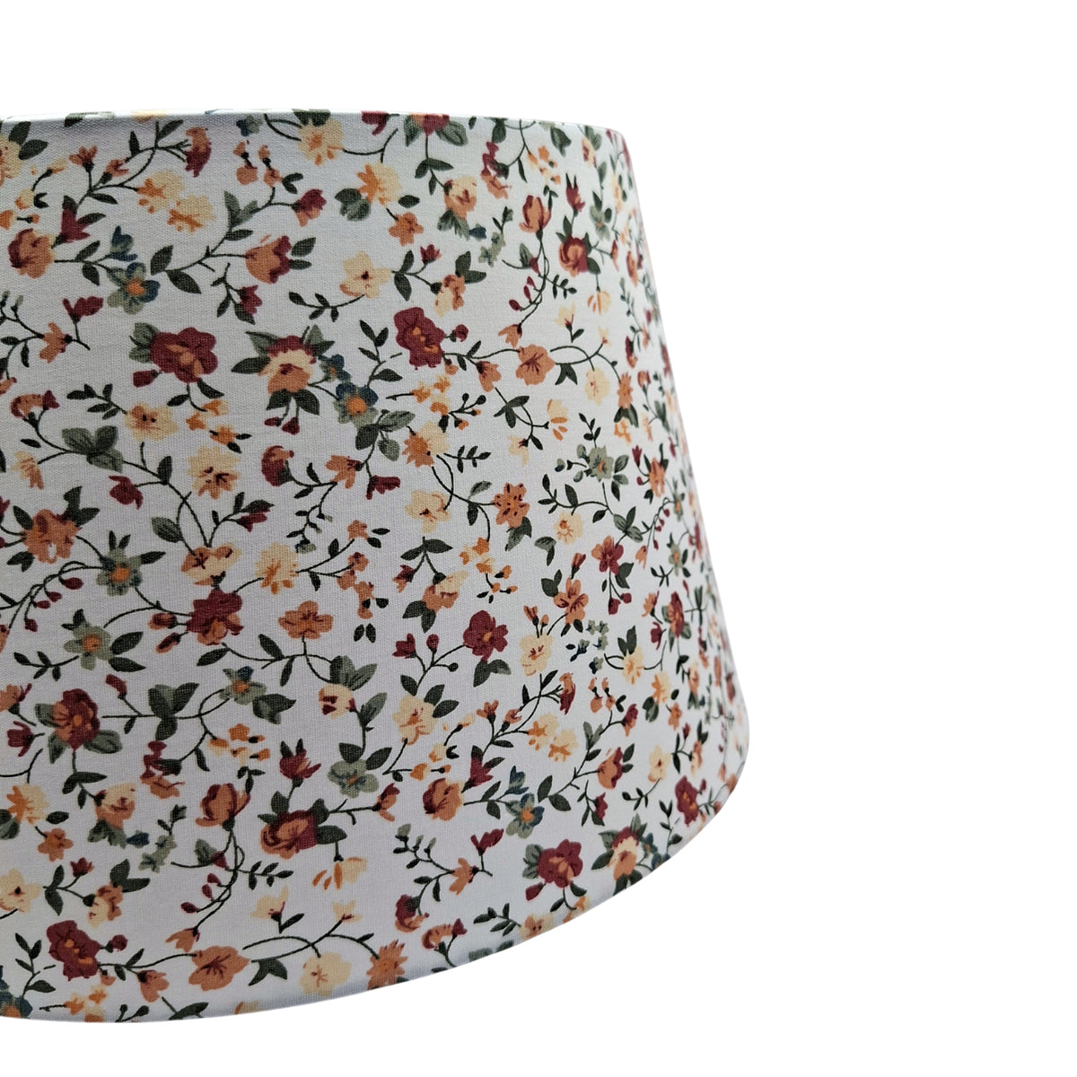 Transform your space with this cream floral lampshade. Its vintage charm brings a warm, bohemian touch to any room.