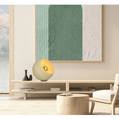 Immerse your space with the serene ice green hues of the Occhio table lamp. Perfect for creating a calming ambiance.