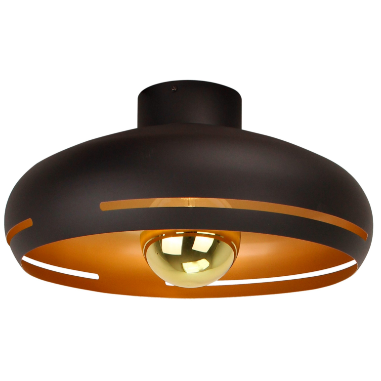 Illuminate your space with the modern black Striscia ceiling light. Its sleek design adds a striking touch to any room.