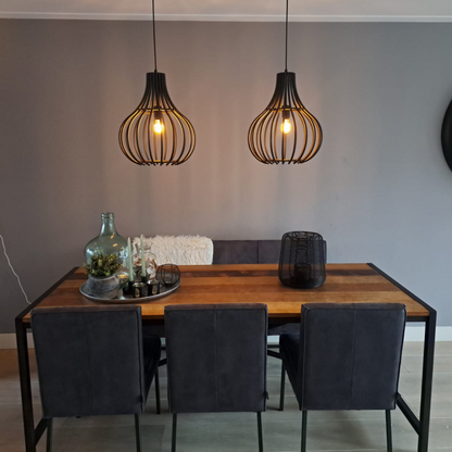 The striking black Goccia pendant light adds a modern touch to any room. Perfect for creating a cozy, inviting atmosphere.