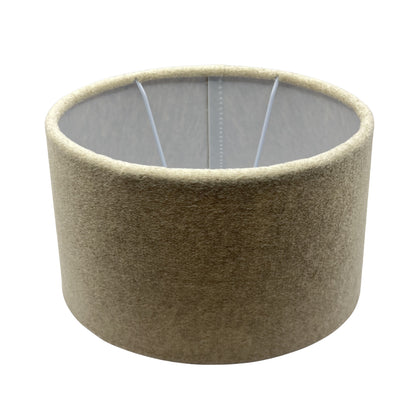 A top view of the oval beige lampshade exudes a modern charm. Perfect for adding warmth and style to any room.
