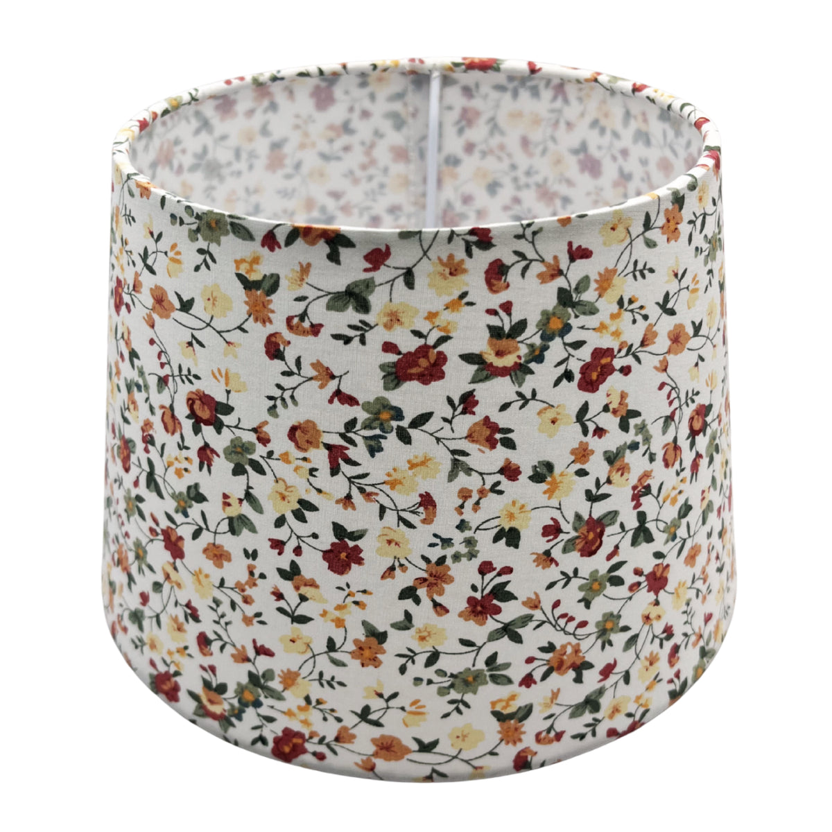 A timeless cream lampshade with a sleek drum shape. Perfectly complements any décor while softening ambient light.