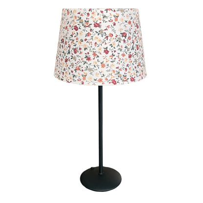 A warm cream lampshade that adds a timeless elegance to any room. Perfect for creating a cozy atmosphere.