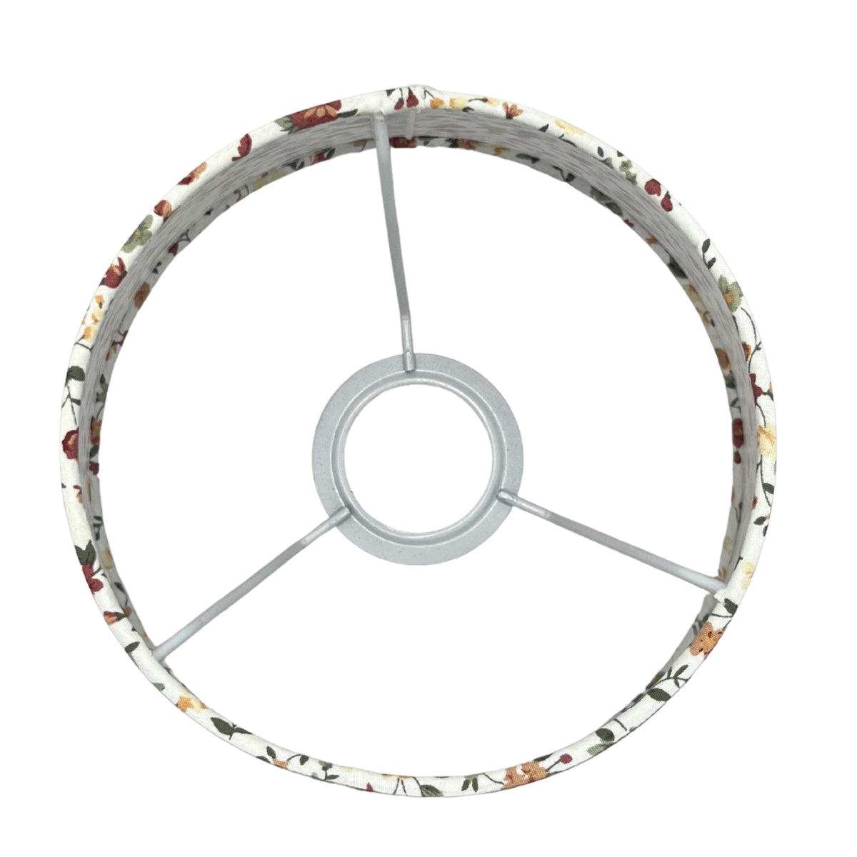 A top view reveals the timeless design of this cream lampshade. Perfect for adding an elegant touch to any light fixture.