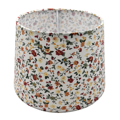 A side view of a cream lampshade, exuding timeless charm. Perfect for adding a soft glow to any interior setting.