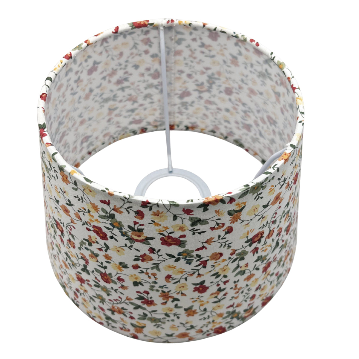 A top view of the cream drum lampshade showcases its timeless design. Perfect for adding warmth to any room.