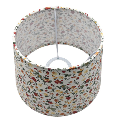 A top view of the cream drum lampshade showcases its timeless design. Perfect for adding warmth to any room.