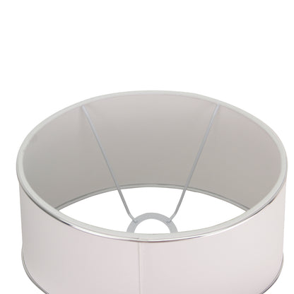 Van bovenaf zie je de elegante ovalen lampenkap in wit en zilver. Perfecte keuze voor een verfijnde sfeer in huis.