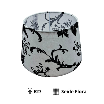 Deze elegante lampenkap in zwart-wit voegt een vintage flair toe aan elke kamer. Perfect voor sfeervolle verlichting.