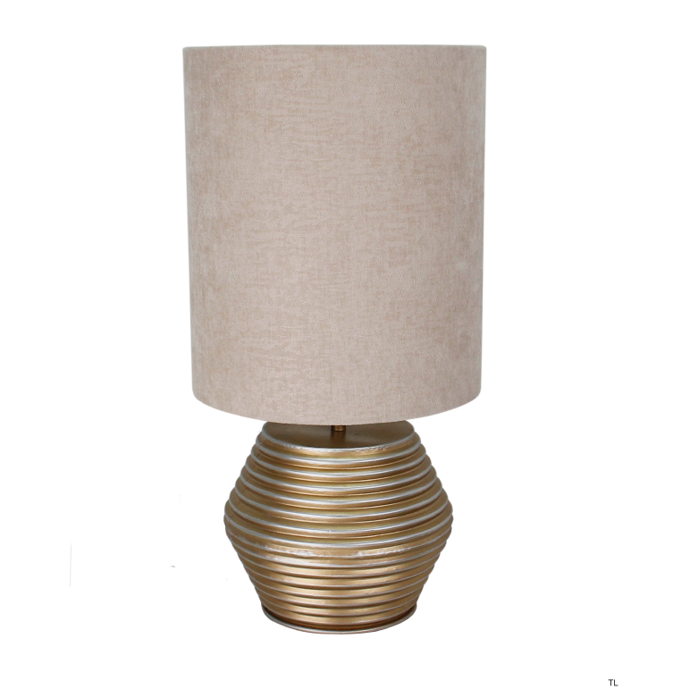 Close-up of the Modena table lamp in cream and gold. A modern accent that adds elegance to any tabletop setting.