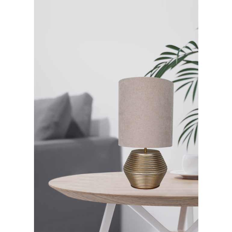 A stunning close-up of the Modena table lamp showcases its cream and gold elegance.
