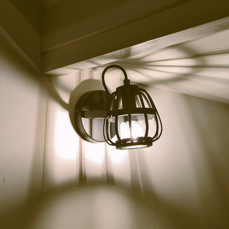 Illuminate your space with the rustic charm of the black Nature Trapeze ceiling light.