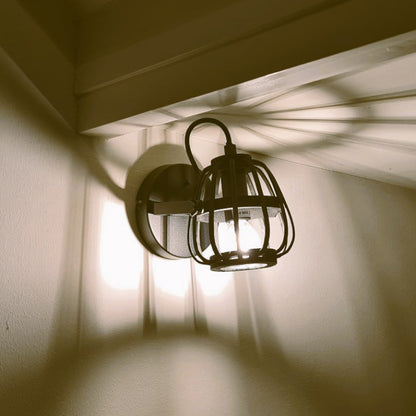 Illuminate your space with the rustic charm of the black Nature Trapeze ceiling light.