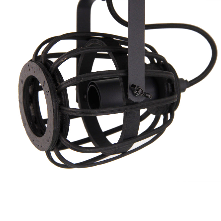 A close-up of the black Nature Trapeze ceiling light showcases its rustic charm. Perfect for adding a touch of elegance to