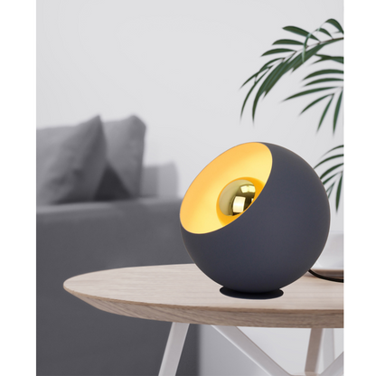 A warm cream table lamp that adds a modern touch to any setting. Perfect for creating a cozy atmosphere at home.