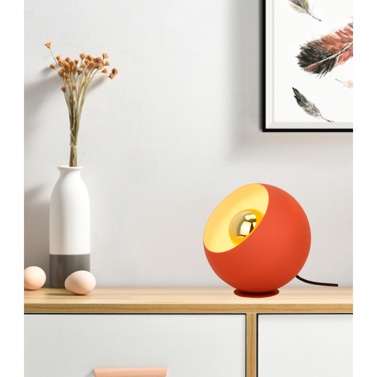 A vibrant red table lamp, perfect for adding a modern touch. Its warm glow sets a cozy atmosphere in any setting.