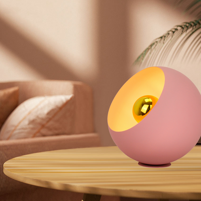 A charming pink table lamp adds a playful touch to modern decor. Perfect for cozy reading nooks or vibrant living spaces.