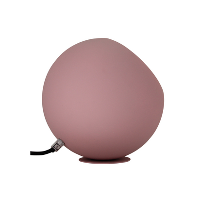 Detail van de moderne roze Occhio tafellamp. Deze unieke lamp voegt een speelse touch toe aan jouw interieur.