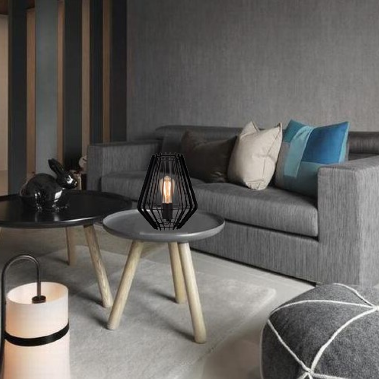 Illuminate your workspace with the Tavola table lamp in sleek black. Its industrial style adds a modern touch to any desk.