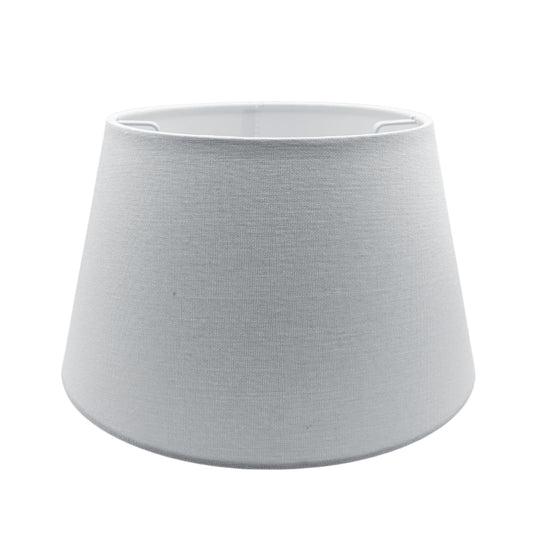 A minimalist off-white lampshade crafted from cotton. It adds a touch of modern elegance to any room.