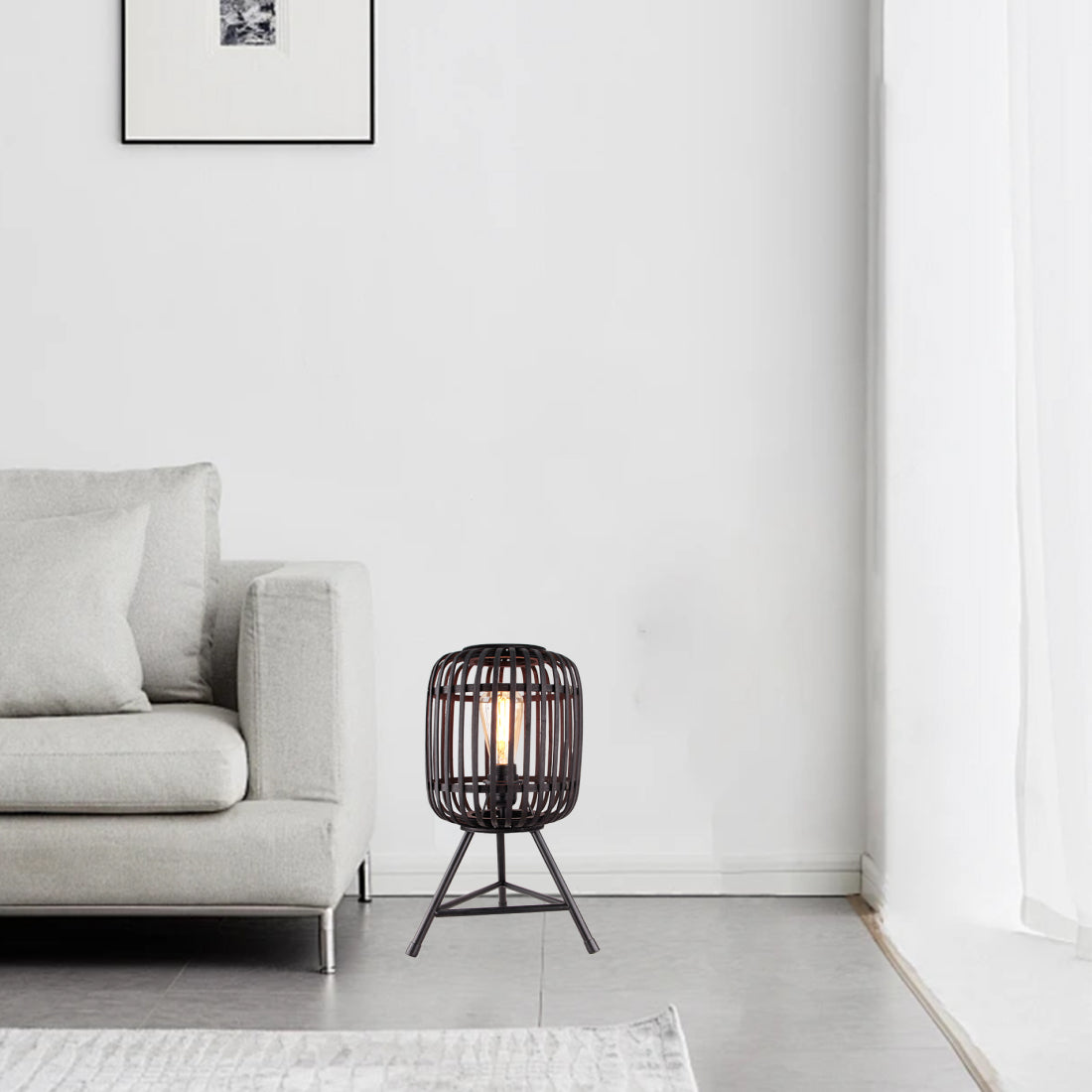 Illuminate your space with the modern black Woven table lamp. Its unique design adds a cozy touch to any room.